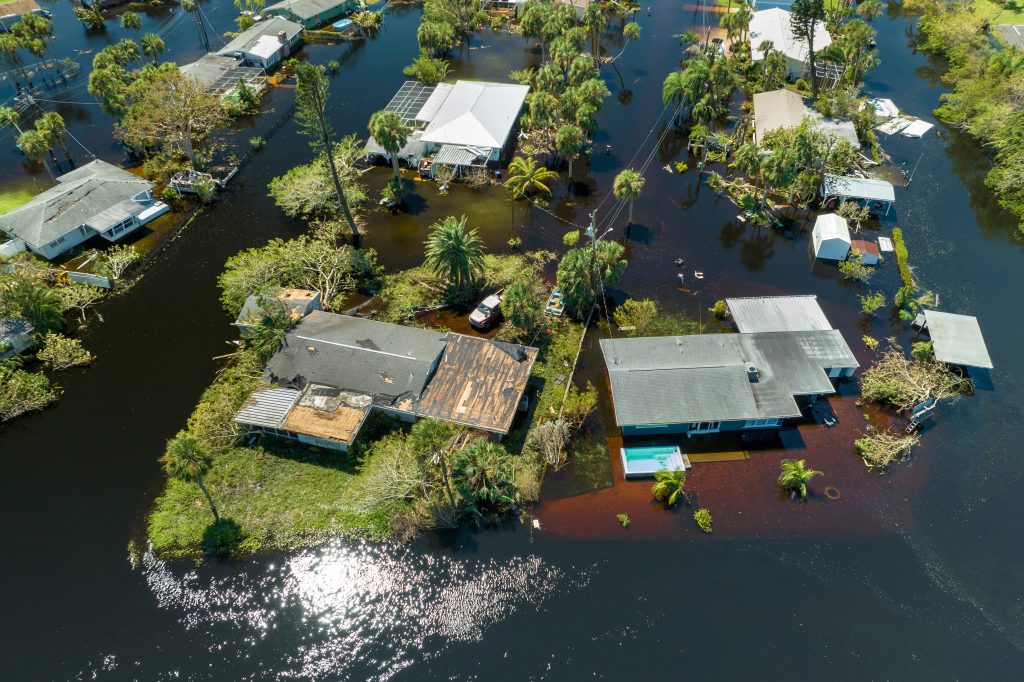 Aftermath of natural disaster. Surrounded by hurricane Ian rainfall flood waters homes in Florida residential area - Today’s customer expects real-time, multi-channel communication—especially when they’re experiencing disruptions. Customized professional audio should be part of an integrated strategy