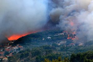 Massive wildfire burning down the forest and villages around city - customized professional audio—tailored messages combined with branded music and voice talent—should be viewed as a frontline communication tool