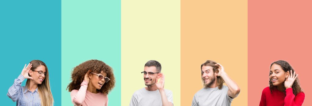 The new year is the perfect time to rethink how your business is heard. - Five different colored stripes with a different person in each holding a hand to their ear to show they are listening.